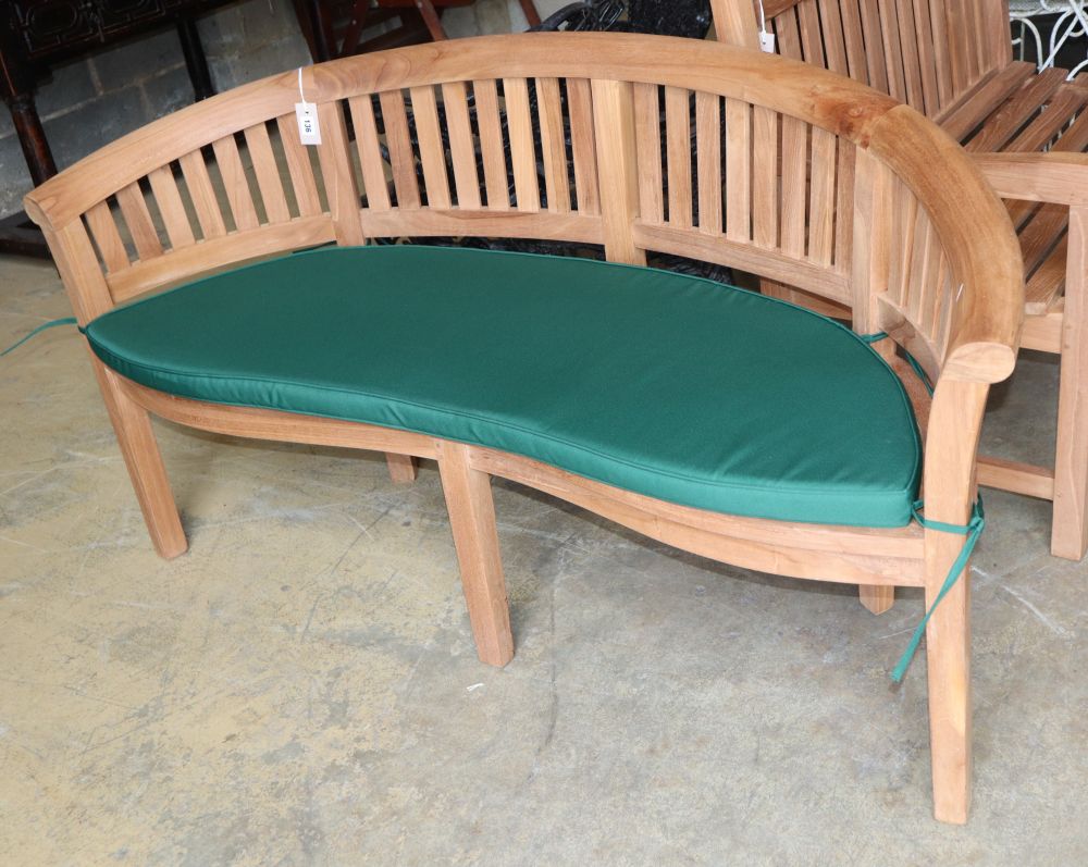 A teak banana garden bench, W.160cm, D.60cm, H.83cm